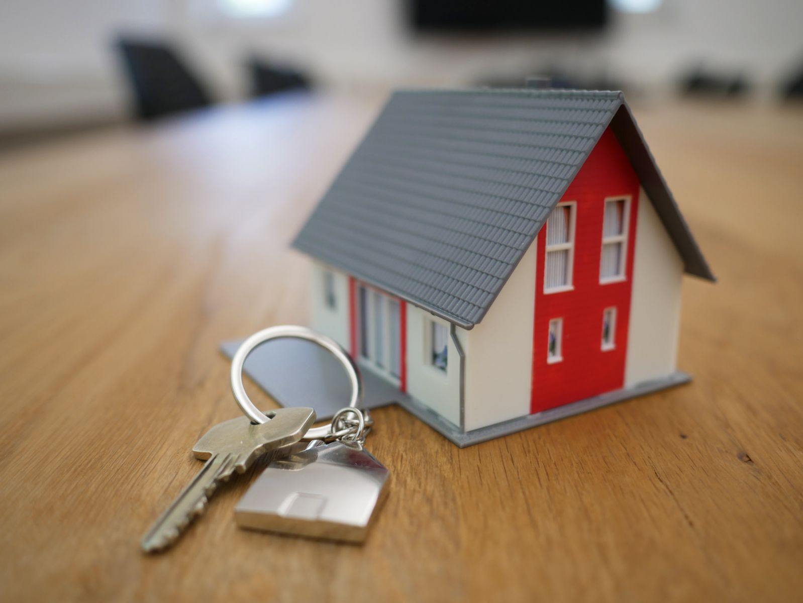model of house with front door keys 