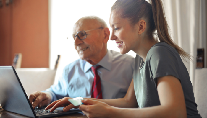 older man getting help with a mortgage application